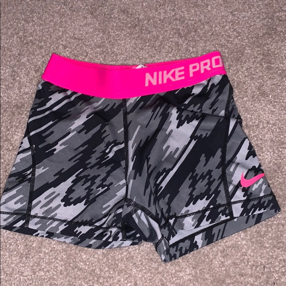 Gray and pink nike pros
